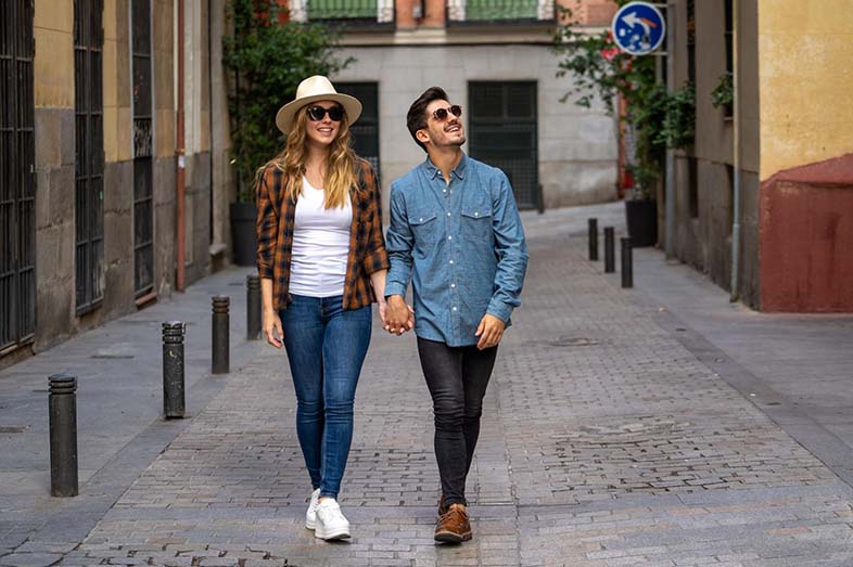 Man and woman strolling in a quiet street