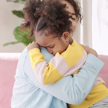 Mom comforting her daughter
