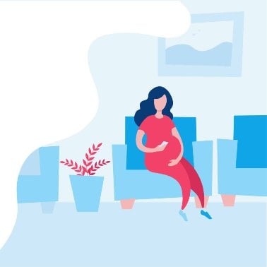 A pregnant mum sitting in a chair